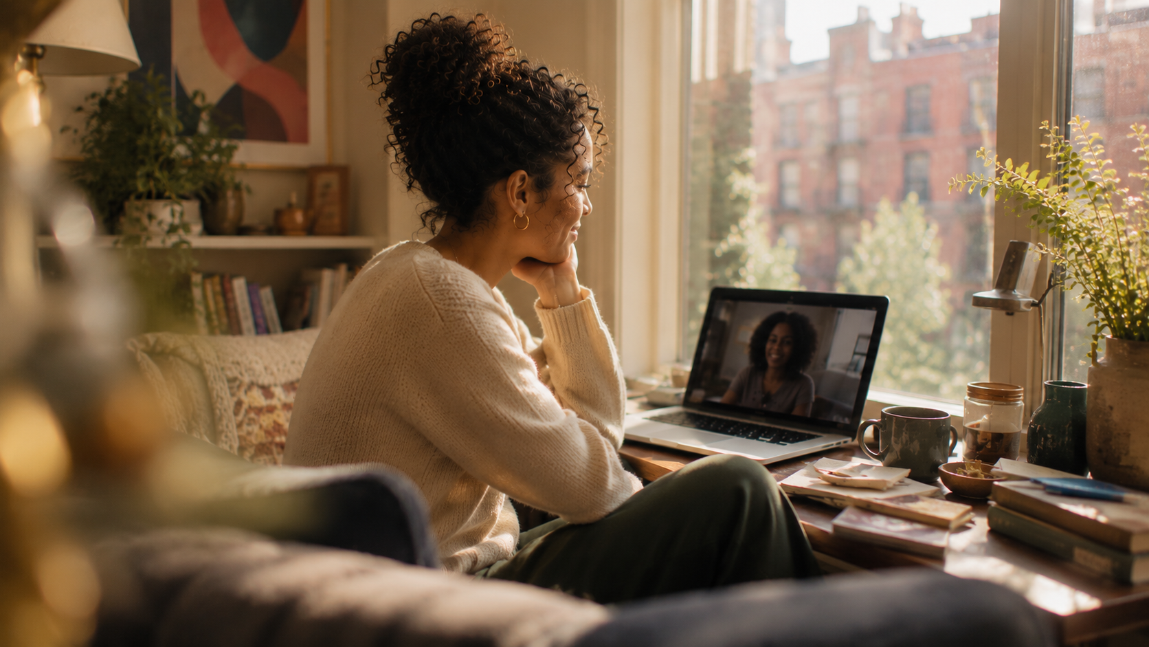 A telehealth evaluation in progress in a warm, light-filled interior